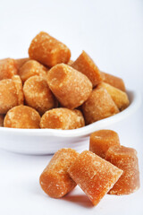 Organic Gur or Jaggery Powder and cubes, Jaggery is used as an ingredient in sweet and savoury dishes in the cuisines of India.