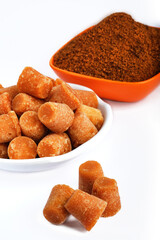 Organic Gur or Jaggery Powder and cubes, Jaggery is used as an ingredient in sweet and savoury dishes in the cuisines of India.