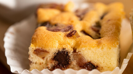 Yellow bakery mixes delicious dried fruit.