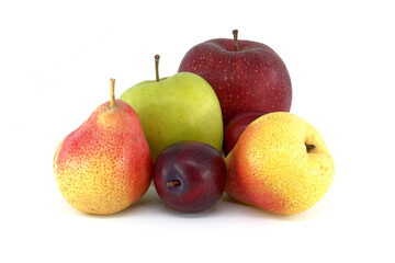 Pear, plums and apples over a white background