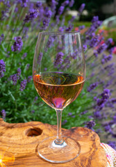 French rose wine from Provence, two glasses of wine with purple lavender flowers on background