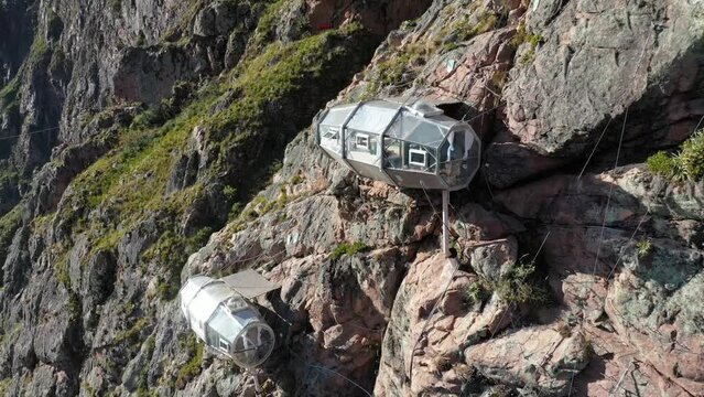 Drone shots of climbers at the Urubamba cliffs in Cusco, Peru. It is also known as the Sacred Valley. Climbers are climbing the mountain to their Airbnb. Shots are in Full HD