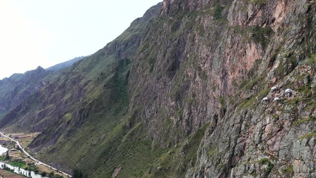 Drone shots of climbers at the Urubamba cliffs in Cusco, Peru. It is also known as the Sacred Valley. Climbers are climbing the mountain to their Airbnb. Shots are in Full HD