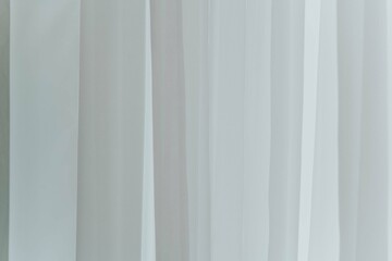 Obraz premium texture of white tulle curtains on the window background