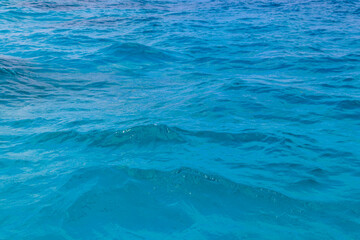 Blue water texture background. Surface of sea or ocean