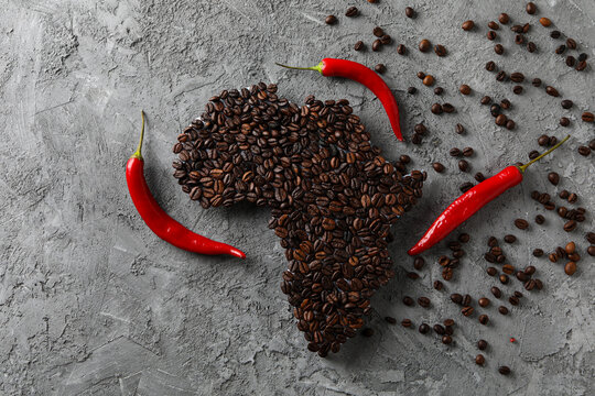African continent made of coffee beans on gray textured background