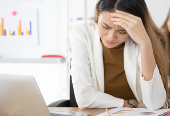 Beautiful asian girl feeling headache and stress in office , concept of healthcare and office...