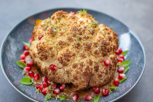 whole roasted oven baked cauliflower with spicy herbs