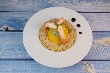 Recipe for Boulghoursotto and mini patisson stuffed with mozarella and basil and its scampi. High quality photo