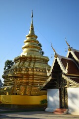 Fototapeta premium Golden pagoda of Wat Phra That Si Chom Thong Worawihan in Chom Thong District, Chiang Mai, THAILAND.