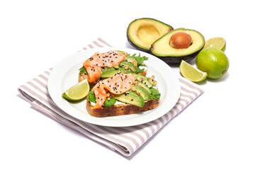 Freshly made Avocado, salmon and cream cheese toasts isolated on white background