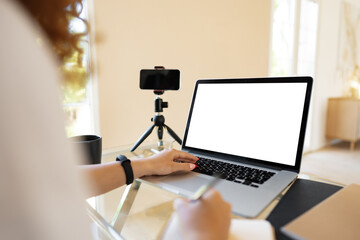 Close up of woman hands typing on laptop keyboard at the office