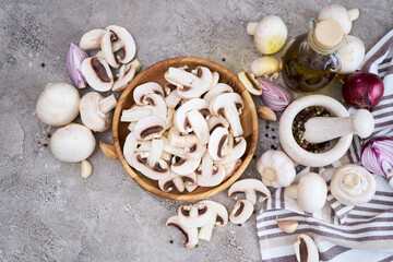 champignon mushrooms in wooden bowl at domestic kitchen