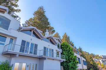 Home exterior with white wood siding and large glass windows in San Francisco, California
