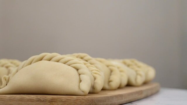 Showing empanadas 3 (Focus - B Roll)