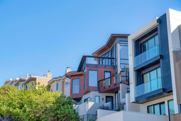 Fototapeta na wymiar Modern and traditional townhouses in a sloped suburbs of San Francisco, CA