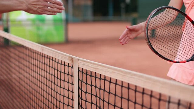 Tennis player waiting for shaking hands on the net, fair play, outdoors