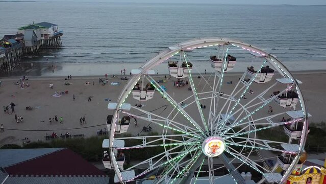 Flying past a ferris wheel towards the ocean at Old Orchard Beach in Maine.