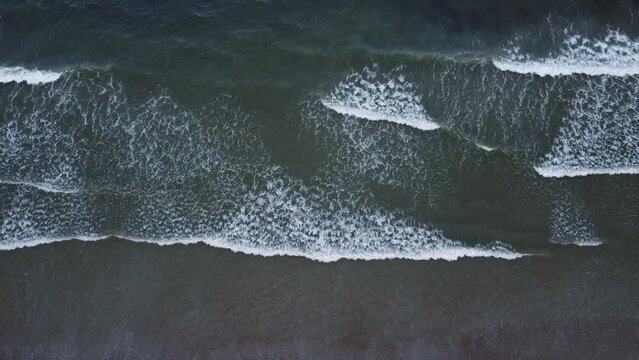Waves rolling towards shore at Old Orchard Beach in Maine.