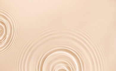 water texture ripples wave clean transparent water abstract background in beige color	
