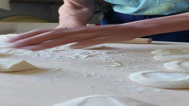 Traditional Buryad Buuz making process. Steamed dumpling filled with meat