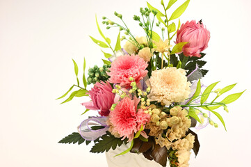 Arrangement of colorful flowers on a white background