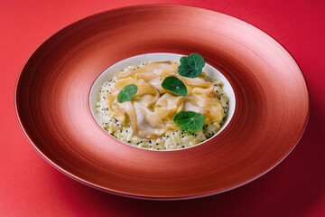 white fish fillet served with steamed rice in a beautiful red bowl