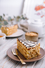 Cake with peanuts, walnuts, chocolate and caramel cream