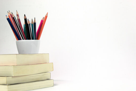 Education materials in the box and books isolated on white background. Back to school poaster concept template design