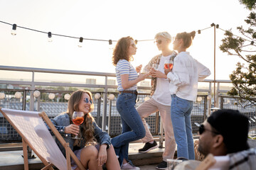 Group of friends have fun at rooftop party
