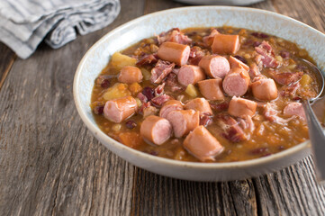 Savory meat stew with smoked pork, vienna sausage, potatoes and vegetables