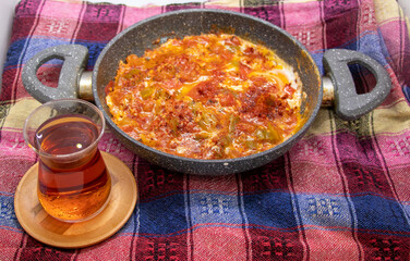 Turkish food is menemen, made with , onions, peppers, tomatoes and eggs.top view 