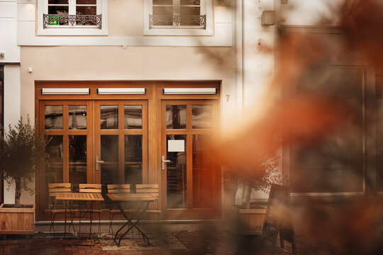 Empty chairs and tables outside cafe