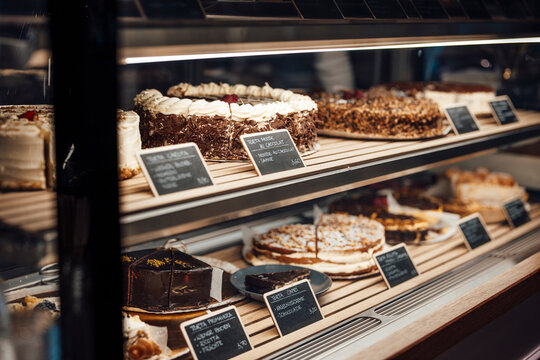 Varieties Of Cakes Arranged On Retail Display At Cafe