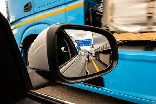 Traffic jam reflecting in side-view mirror
