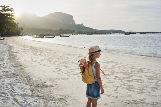 Girl admiring sea at beach