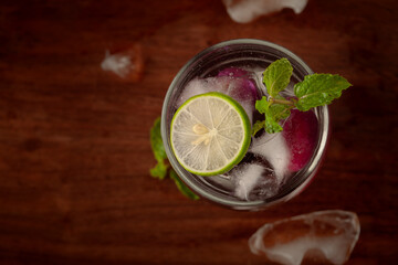 Close-Up of  fresh organic fruit jamun (Syzygium Cumini)  lemonade with lime and chilled water and ice