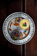 Pudding dessert.pudding, dessert, chocolate, vanilla, blueberries, almond, hazelnut, apricot, candy, sweet, birthday, yellow, black, contrast, retro, celebration