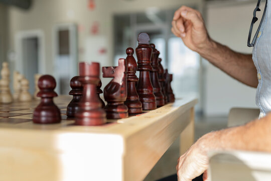 Businessman playing chess in office