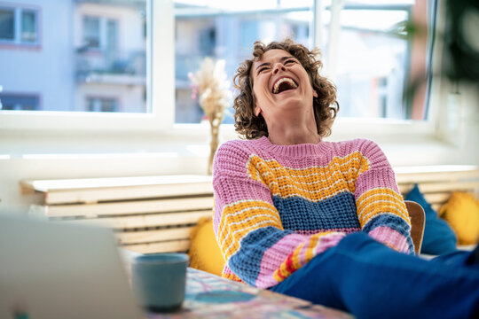 Cheerful Woman Laughing At Home