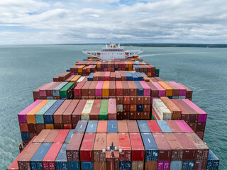 Container Ship at Sea Moving Cargo for International Trade