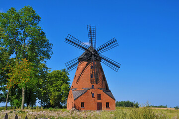 Fototapeta na wymiar A brick Dutch windmill from the 19th century in Stara Różanka, Warmian-Masurian Voivodeship, Poland