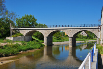 Fototapeta na wymiar Kwisa river and bridge in Gryfow Slaski, city in Lower Silesian Voivodeship, Poland.