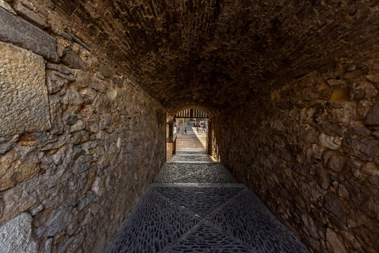 Tunnel in an old stone wall around the ancient city of Tarraco (current day Tarragona, Spain)
