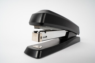 Black paper stapler on a white background 