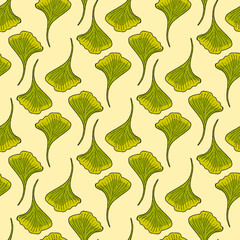 Seamless pattern with ginkgo biloba leaves on light yellow background. Vector image.