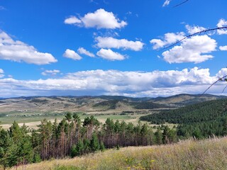 Scenic view of mountains, forests and valleys from mountain peak