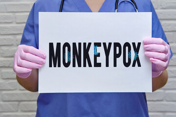 Doctor and inscription monkeypox virus, quarantine due to disease pandemic. Nurse and text monkey...