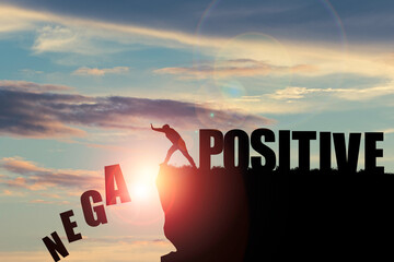 Silhouette man pushing to change wording from negative to positive for mindset concept.