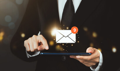 Businessman hand holding tablet and shows a digital screen of new email notifications.